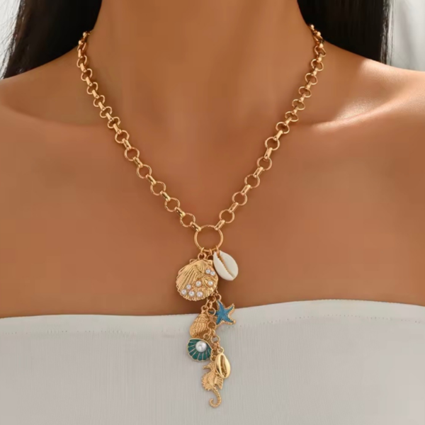 tresor_de_la_mer_gold_naszyjnik_z_naturalna_muszla_orvella1 tresor_de_la_mer_gold_naszyjnik_z_naturalna_muszla_orvella1