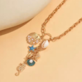 tresor_de_la_mer_gold_naszyjnik_z_naturalna_muszla_orvella2