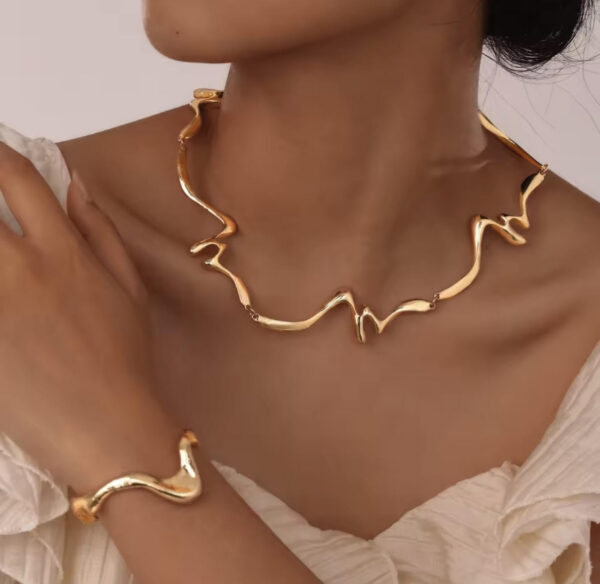 komplet_naszyjnik_bransoleta_velora_wave_gold_14k_zloto_orvella.jpg Komplet biżuterii Velora Wave gold Rzeźbiarski pokryty 14K złotem